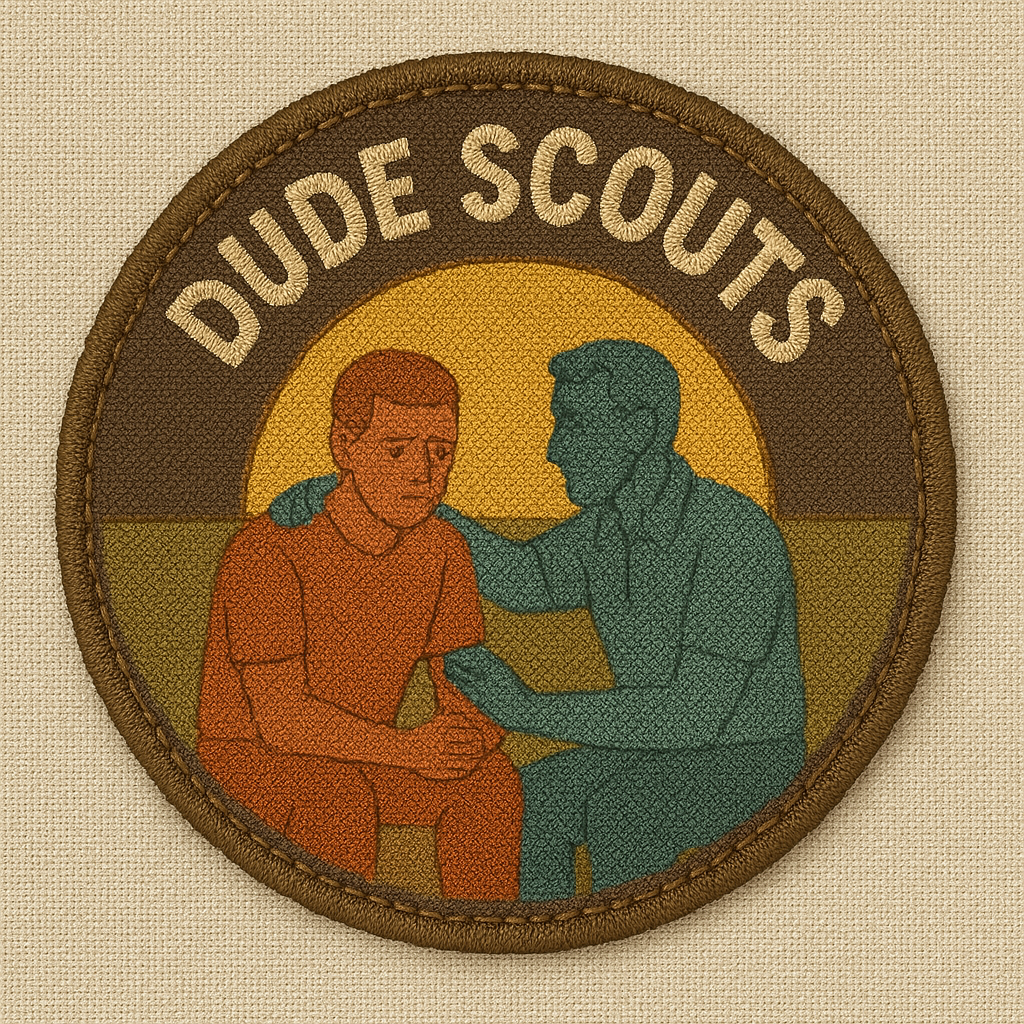 One scout consoles a downcast friend against a sunset backdrop.